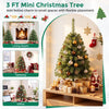 Mini tabletop Christmas tree with 113 green PVC branch tips decorates a cozy living room beside festive gifts.