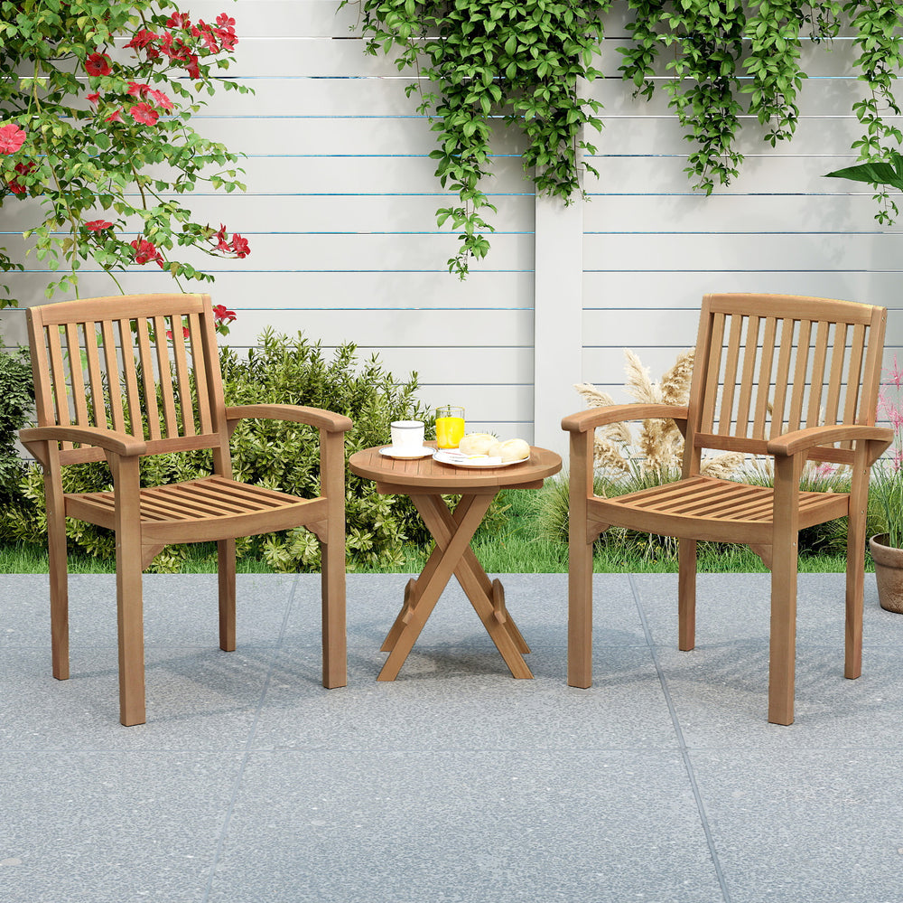 Outdoor patio table made of Indonesian teak wood, paired with slatted chairs, perfect for garden gatherings and.