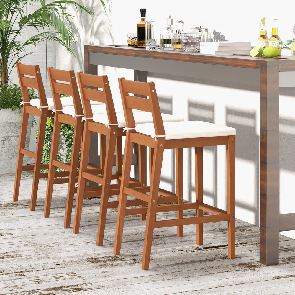 Set of 2 outdoor wood barstools with soft off-white cushions, featuring a sturdy eucalyptus frame and ergonomic design.