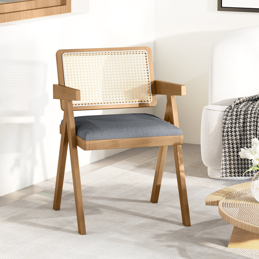 Rattan accent chair with gray padded cushion and rubber wood frame, designed for comfort and farmhouse style in any.