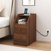 Walnut side end table with charging station, open compartment, and two drawers for organized storage beside a sofa.