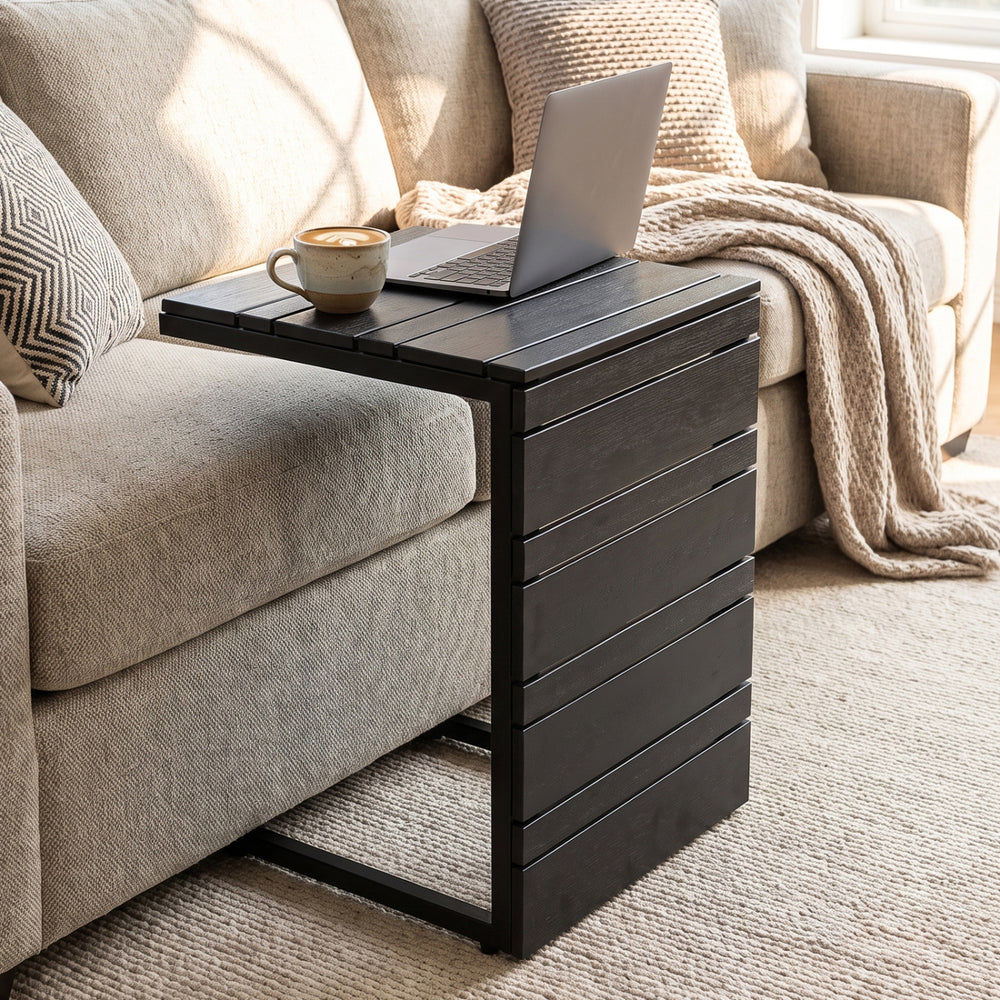 C-shaped side table in black with a slatted wood-plastic top, ideal for convenient placement beside sofas or beds.