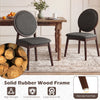 Set of 2 black upholstered kitchen side chairs with solid rubber wood frame and ergonomic padded backrest for comfort.