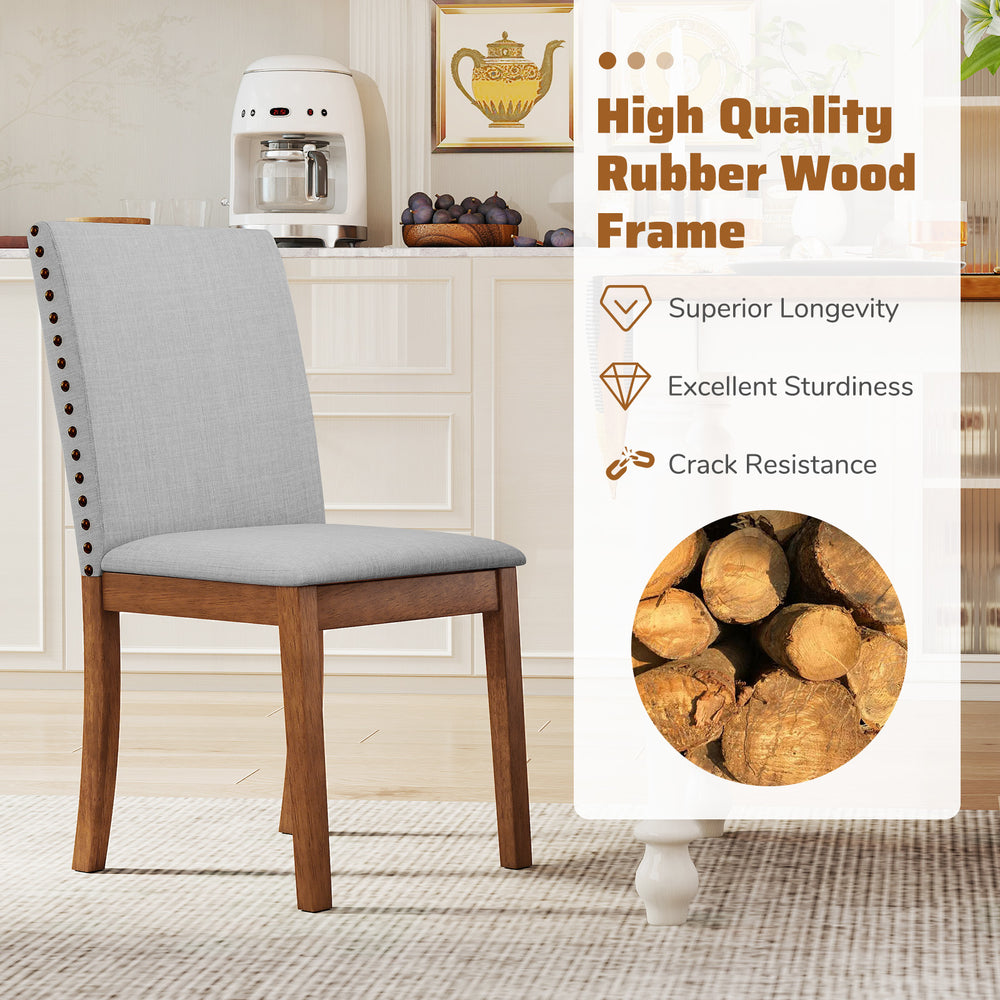 Upholstered dining chair with padded seat, walnut rubber wood frame, and elegant nailhead trim for stylish dining.