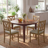Round dining table set with four oak dining chairs, featuring hollowed backrests and soft padded seats, ideal for.