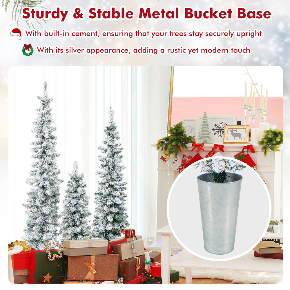 Set of 3 snowy flocked artificial Christmas trees in metal bucket bases for stable holiday decorating.