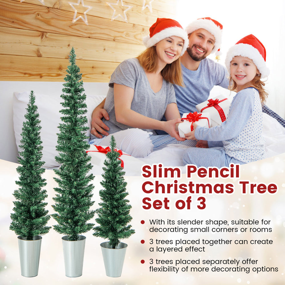 Set of 3 potted artificial Christmas trees in silver metal buckets, perfect for small spaces and versatile holiday.