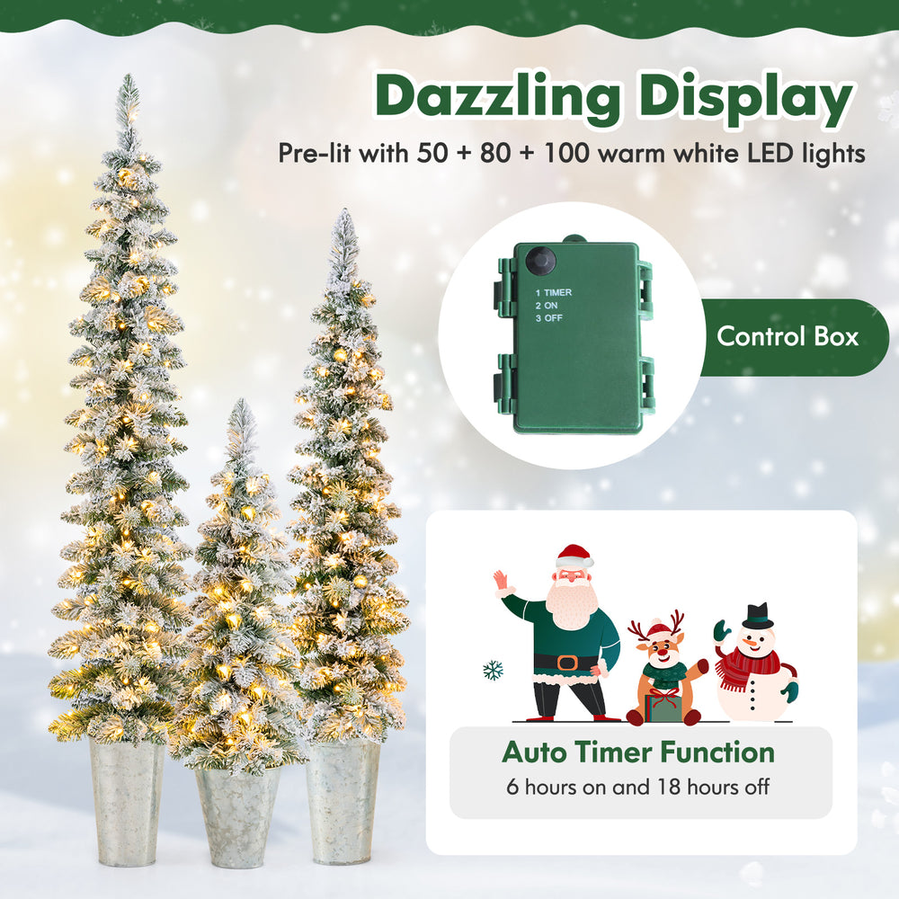 Set of 3 pre-lit snow flocked artificial Christmas trees with warm white LED lights and auto timer function for festive.