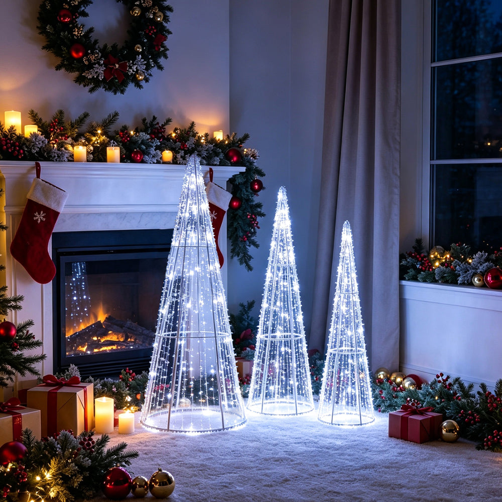 Three pre-lit Christmas cone trees with star strings in cold white, perfect for festive indoor or outdoor holiday decor.