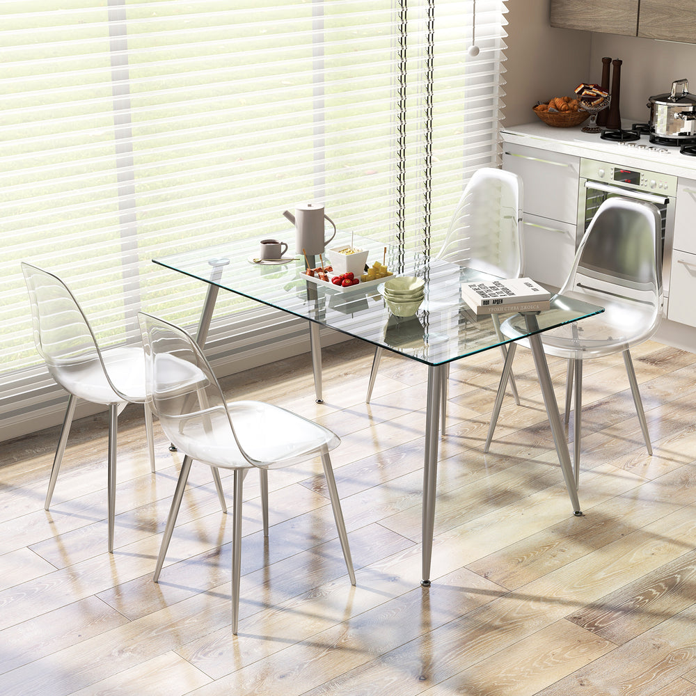 Modern dining table set featuring four clear plastic shell chairs with solid wood legs, ideal for contemporary kitchens.