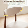 Curved back detail of a beige fabric upholstered dining chair, offering ergonomic support and comfort for dining spaces.