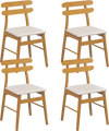 Set of 4 upholstered dining chairs with padded seats and solid rubber wood legs for comfortable dining experiences.