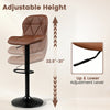 Upholstered swivel bar stool in brown with adjustable height, curved backrest, and sturdy metal base for kitchen islands.