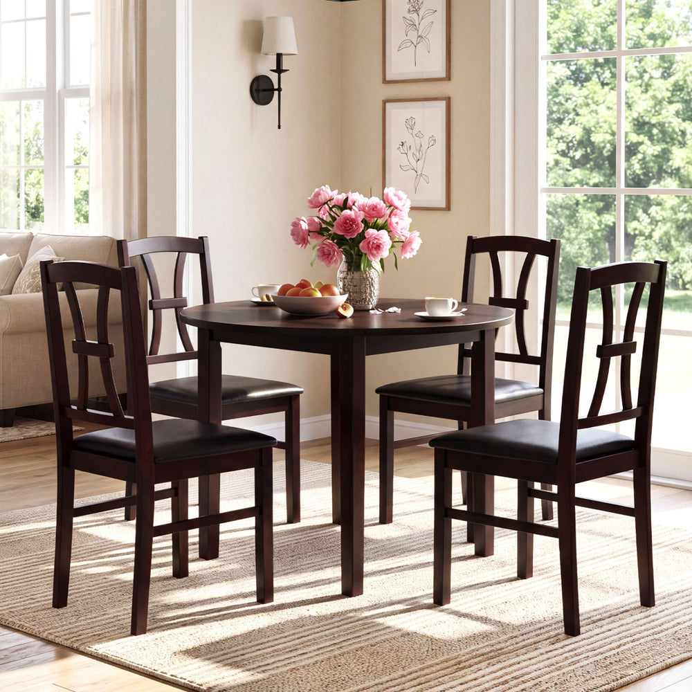 Set of 4 brown wooden dining chairs with faux leather padded seats, perfect for a stylish kitchen dining area.