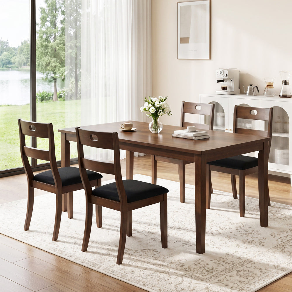 Set of 4 walnut wooden dining chairs with padded seats and ergonomic backrests, perfect for dining rooms and kitchens.