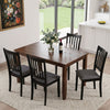 Set of four black wooden upholstered dining chairs with thick padded seats, perfect for dining rooms and kitchens.