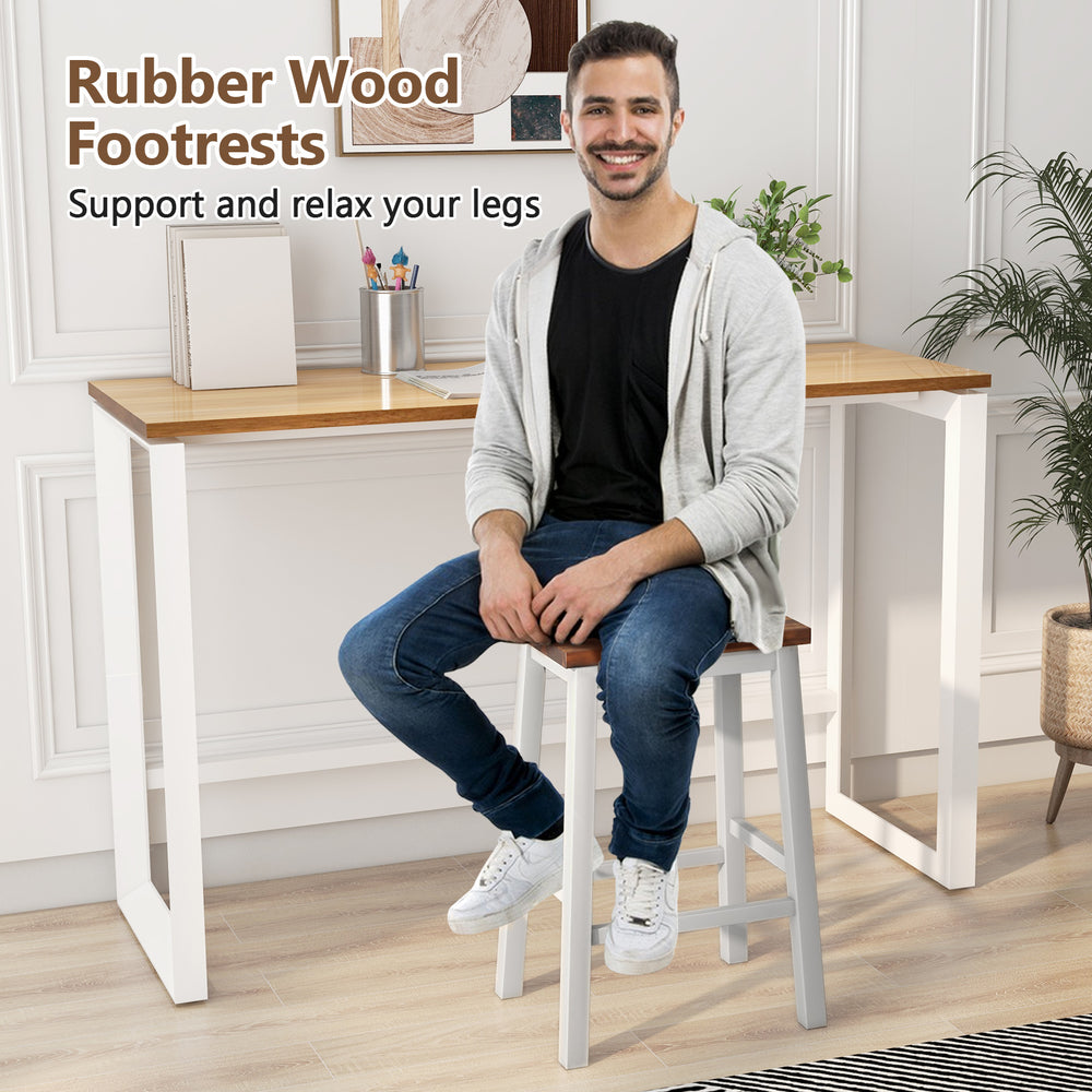Saddle stool with rubber wood footrests, ergonomic curved seat, and acacia wood legs for kitchen island comfort.