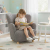 Cozy silver Sherpa toddler armchair featuring a plush design, perfect for reading in playrooms or nurseries.
