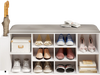 Shoe storage bench in white with umbrella stand, featuring adjustable shelves and a button-tufted padded seat for.