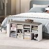 Shoe storage bench in white with umbrella stand, featuring 10 storage cubes and a button-tufted padded seat for.