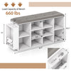 Shoe storage bench in white with adjustable shelves, umbrella stand, and button-tufted PU leather seat for entryway use.