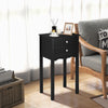 Elegant black side table with a glossy finish and vintage metal handles, perfect as a bedside or living room accent.
