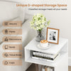 S-shaped side table in white with two open compartments, perfect for books and decorations in small spaces.