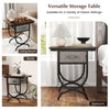 Side table with fabric drawer and carved metal frame, featuring a rustic wood grain top for living room or bedroom use.