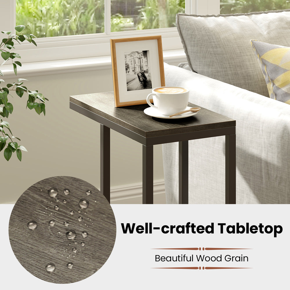 C-shaped side table with oak wood grain finish and heavy-duty metal frame, perfect for small spaces and afternoon tea.