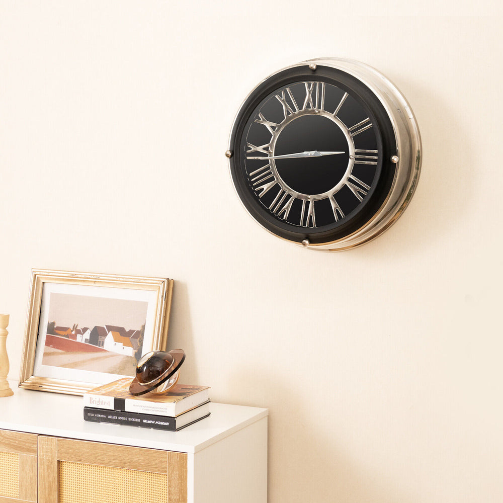 Silent wall clock with a silver frame, featuring decorative numbers and a dust-proof glass cover for elegant decor.