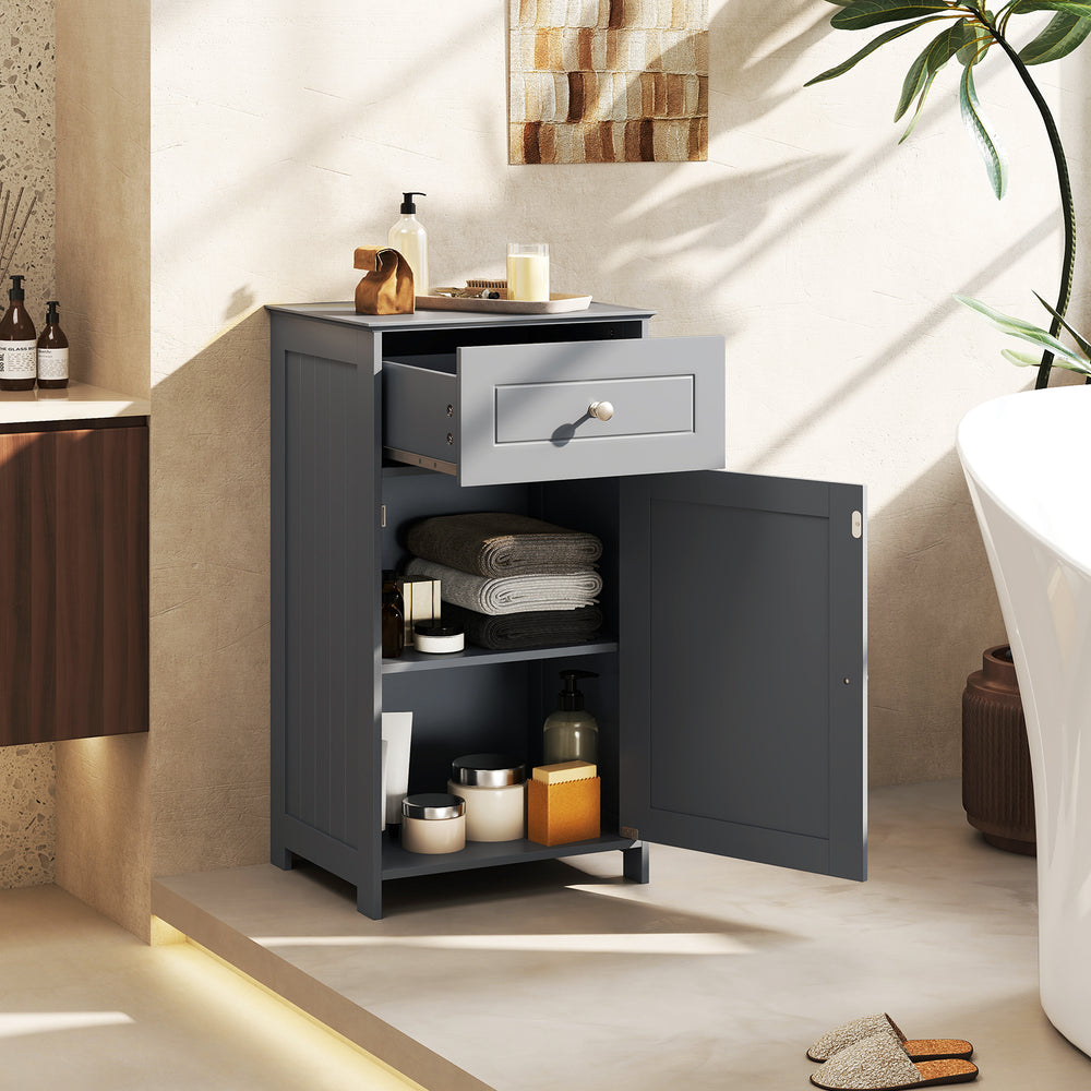 Gray single door bathroom cabinet with adjustable shelf and drawer, ideal for versatile storage solutions.