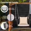Single person hanging seat featuring a woven rattan backrest and soft cushions, perfect for backyard relaxation.