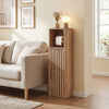 Slim freestanding toilet paper holder stand in natural wood with slat design, ideal for narrow bathroom spaces.