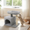Small cat tree in light gray with a large padded perch and sisal scratching post, ideal for indoor cats.