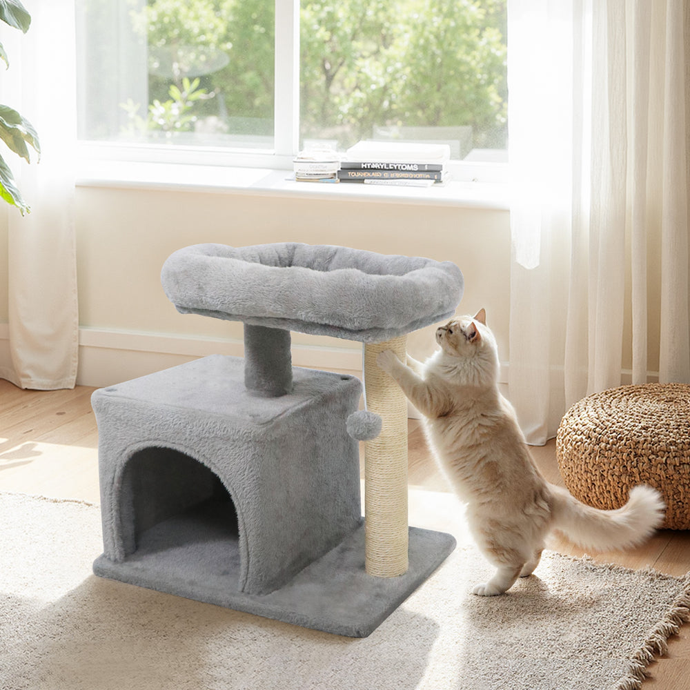 Small cat tree in light gray with a large padded perch and sisal scratching post, ideal for indoor cats.
