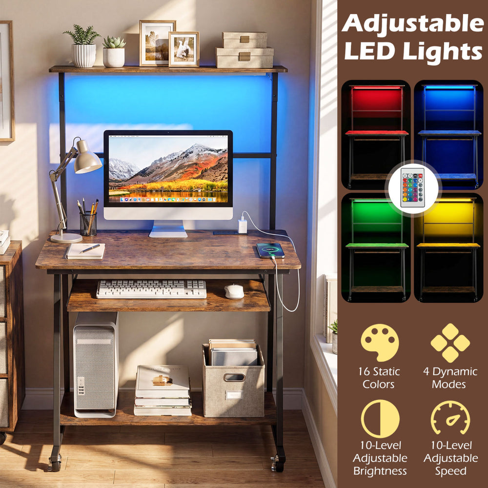 Small computer desk in rustic brown with adjustable LED lights, charging station, and wheels for easy mobility.