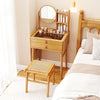 Small bamboo vanity desk with mirror, two drawers, and storage shelves, ideal for compact bedrooms.