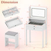 Small white vanity desk with mirror, lights, and cushioned stool, featuring organized storage and sleek glass top.