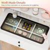 Small white vanity desk with glass top and organized compartments, featuring integrated power outlets for easy access.