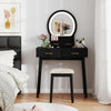Black small vanity makeup dressing table set with cushioned stool and LED lighted mirror, ideal for compact bedrooms.