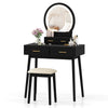 Black small vanity makeup dressing table set with cushioned stool and LED lighted mirror for compact bedroom spaces.