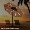 Hawaiian style 10-foot solar lighted thatched patio umbrella with 32 LED lights, ideal for outdoor relaxation.