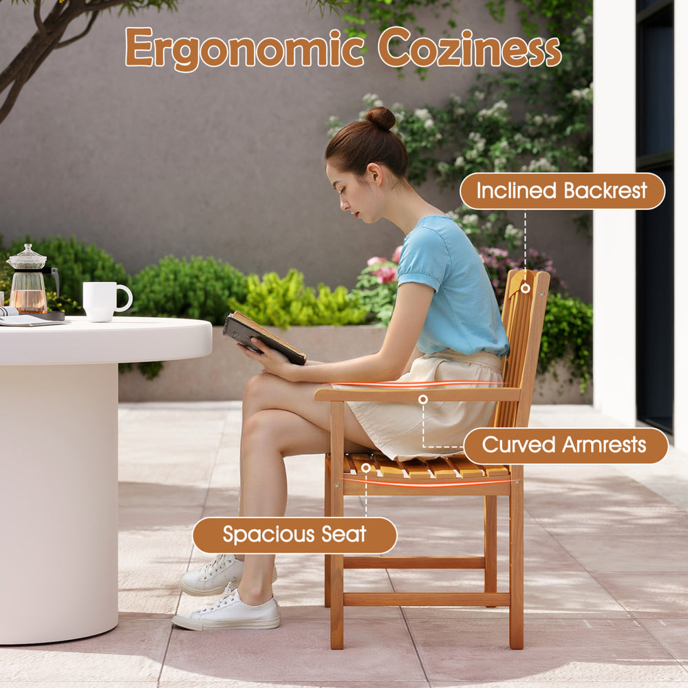 Solid acacia wood patio chair with inclined backrest, curved armrests, and spacious slatted seat for outdoor comfort.