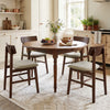 Round dining table set with four walnut solid rubber wood chairs featuring curved backrests, ideal for stylish dining.