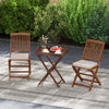 Teak wood tray table with removable top and two folding chairs, perfect for outdoor patio dining and gatherings.