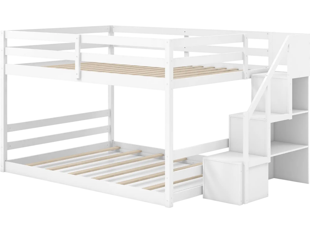 White solid wood full over full low bunk bed with storage stairs and guardrails, ideal for kids' rooms and sleepovers.
