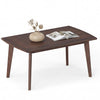 Solid wood modern coffee table with tapered legs in walnut finish, featuring a wide tabletop for easy access to items.