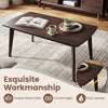 Solid wood coffee table with tapered legs, unique wood grain, and curved edges for easy upkeep in walnut finish.