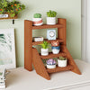 Solid wood plant stand with four tiers, featuring a smooth finish, perfect for displaying potted plants on tabletops.
