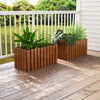Solid wood raised garden bed with slat design, ideal for flowers and vegetables, placed on a patio for outdoor charm.